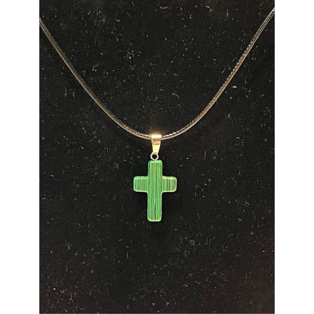 Green Stone Cross on a Black Necklace Cord